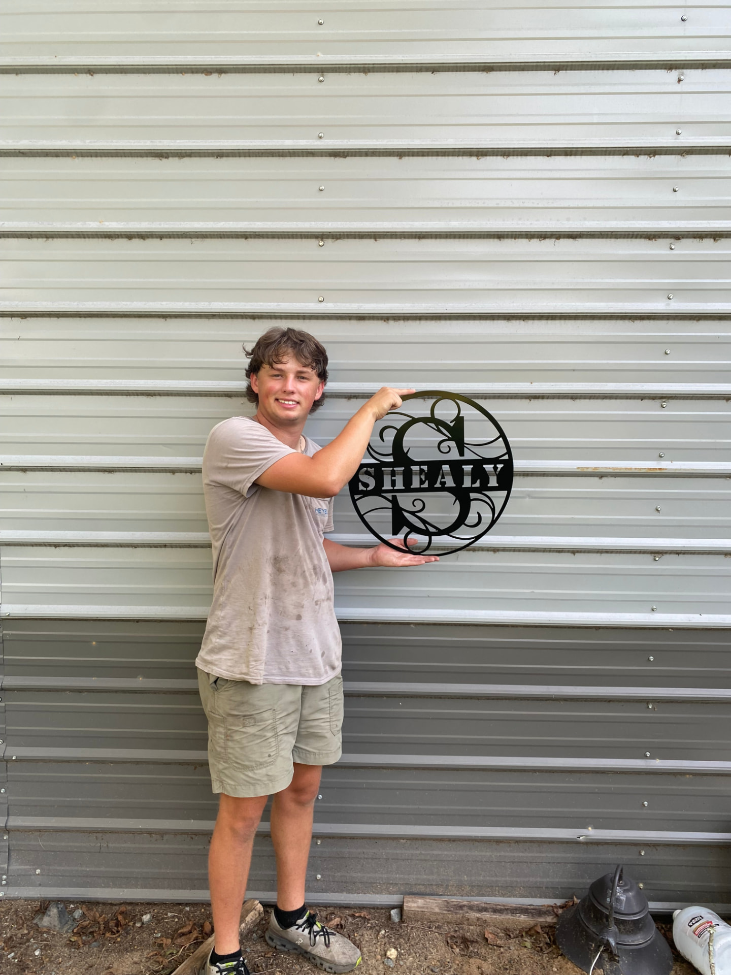 Round plasma-cut Shealy family last name sign in steel
