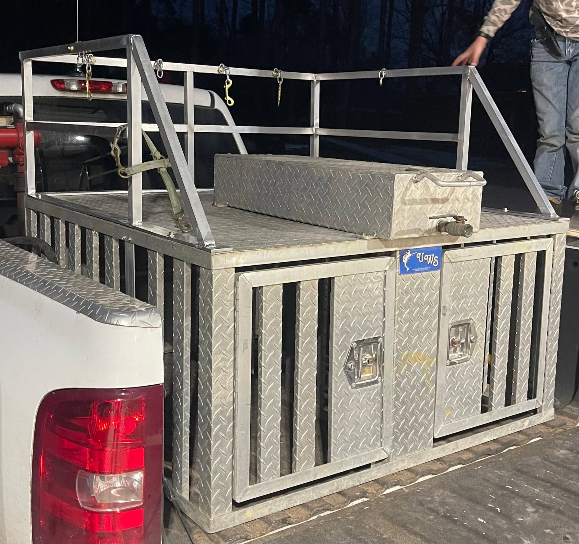 Custom aluminum truck bed dog box with diamond plate and rails